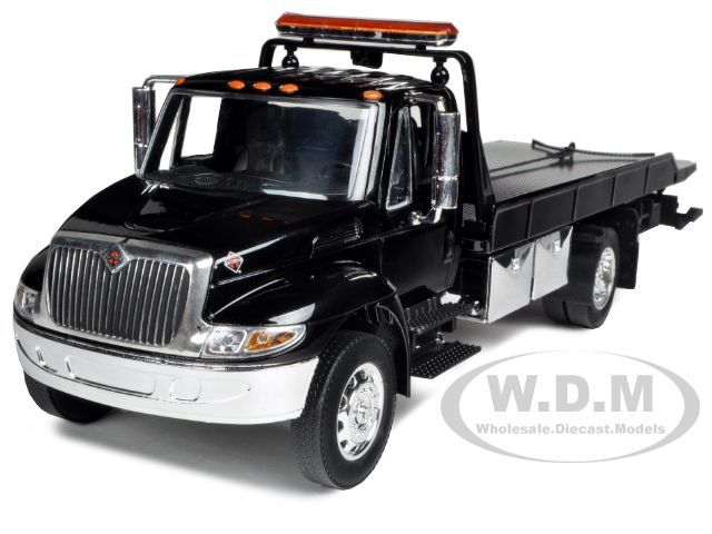 INTERNATIO​NAL DURASTAR 4400 FLAT BED TOW TRUCK BLACK W CHROME BED 1 