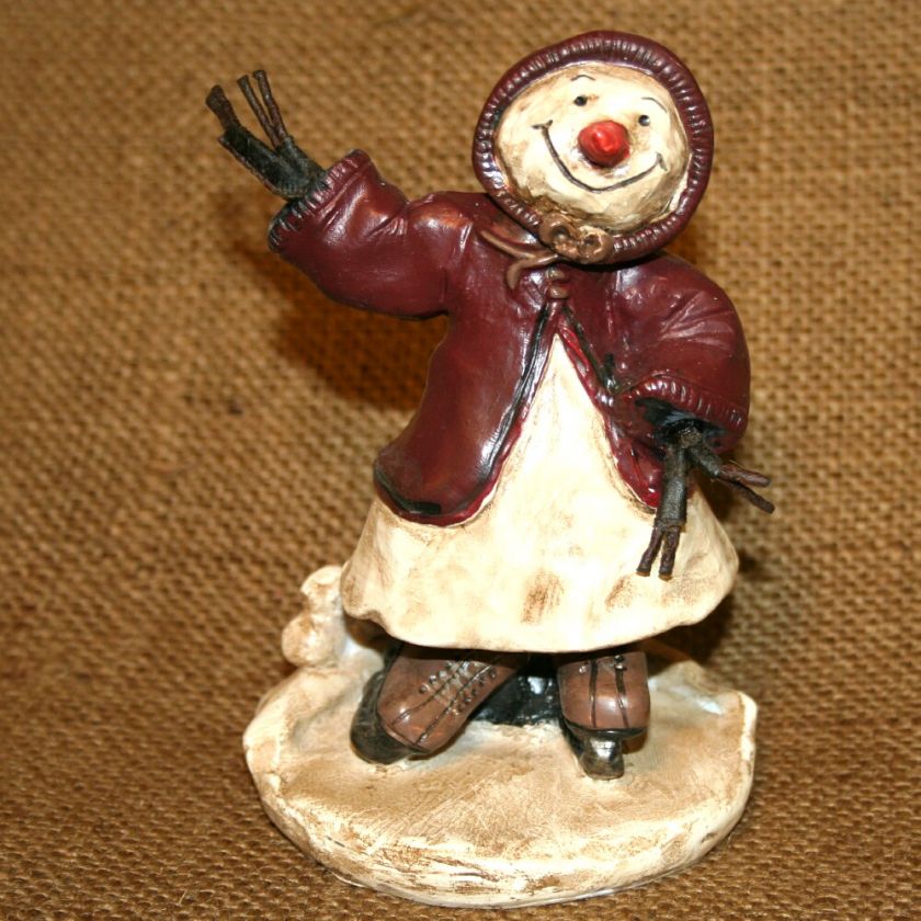 This rustic snowgirl / snowman is 4 3/4 inches tall by 3 inches wide 